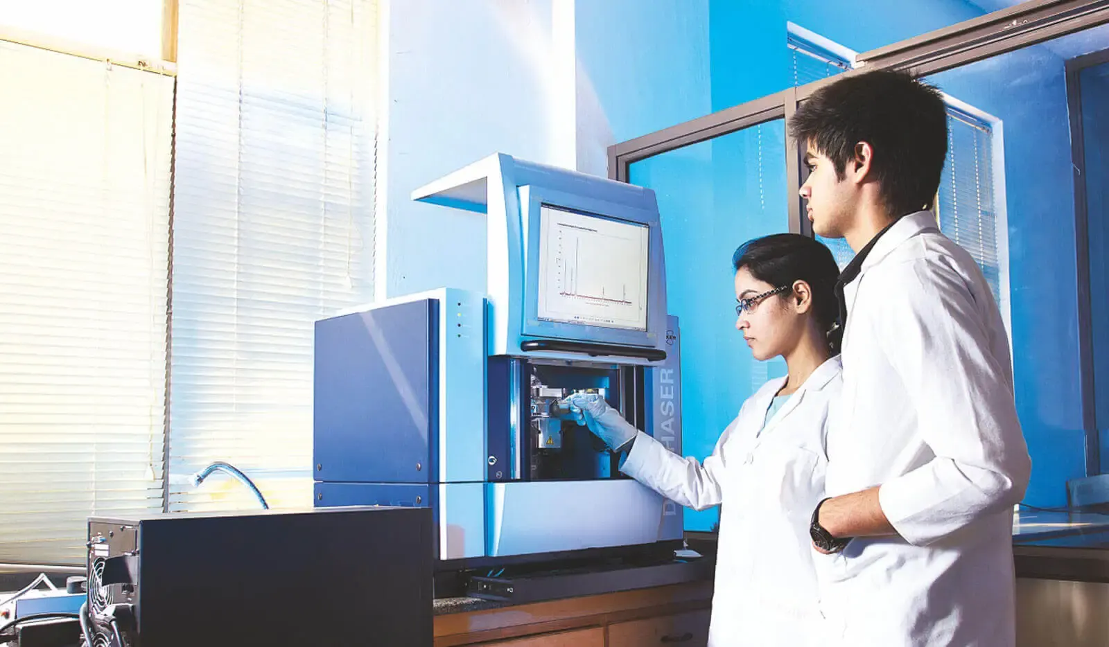 Students working with lab equipment at Amity University