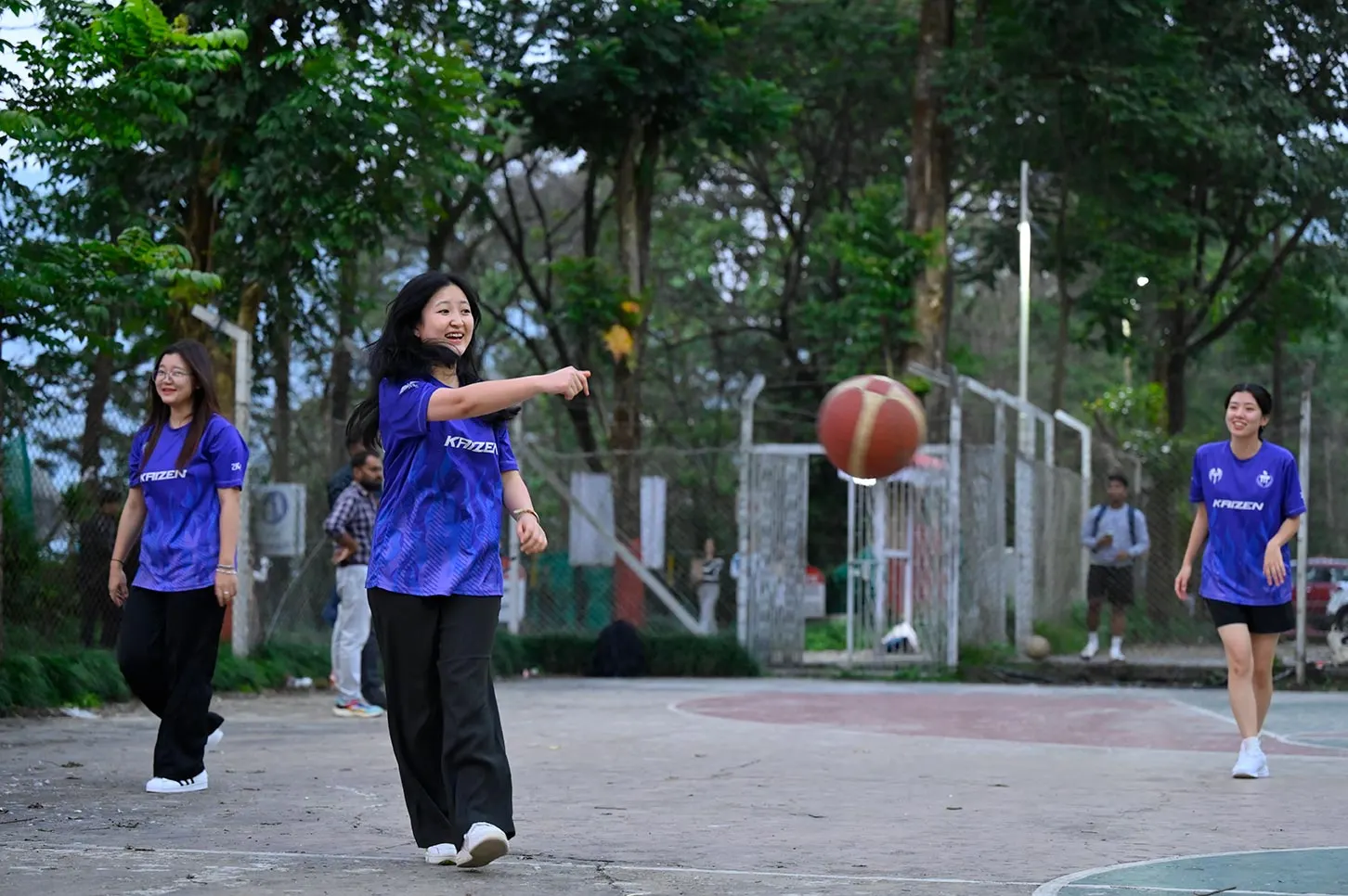 Students playing basketball on campus at Sikkim Manipal University